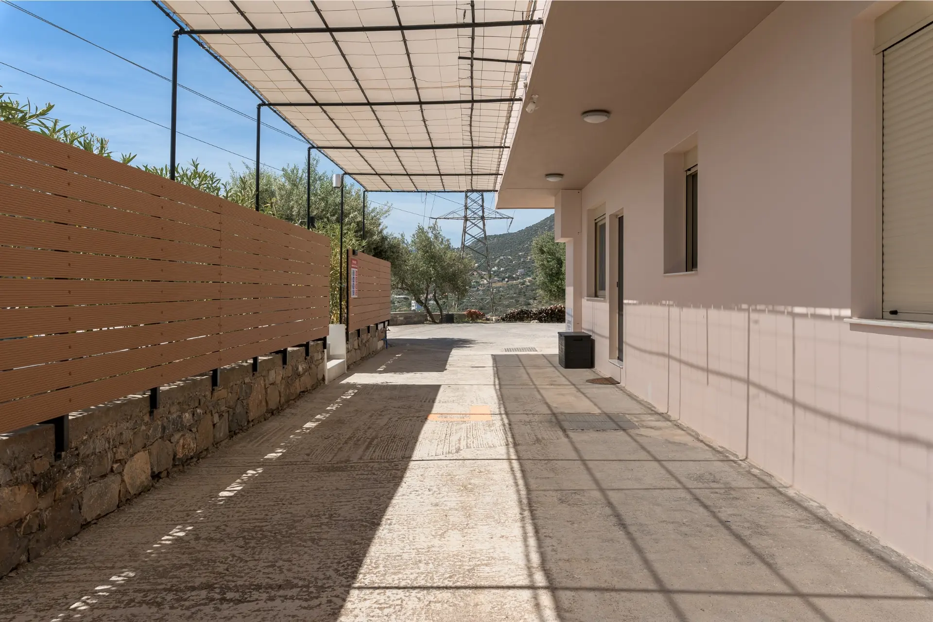 rias-apartment-entrance-parking-courtyard
