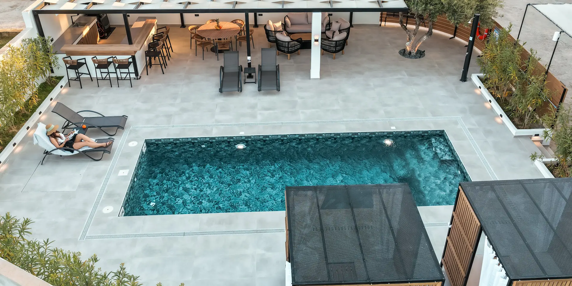 rias-apartment-luxury-pool-outdoor-lounge-aerial-banner